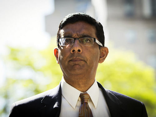 Conservative commentator and best-selling author Dinesh D'Souza exits the Manhattan Federal Courthouse after pleading guilty in New York/ Reuters
