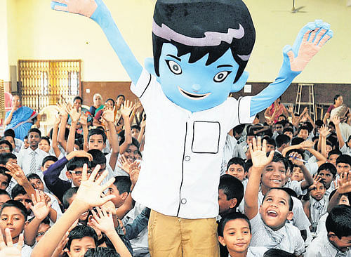 Students were overjoyed seeing 'Kris,' a popular cartoon character, at a school in the City on Friday. dh photo