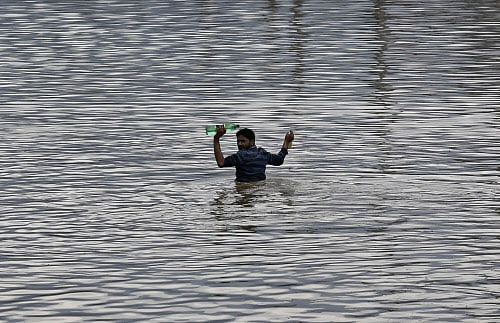 Fourteen children who died at a hospital here are among the 43 people found dead in the Kashmir Valley as the flood waters receded in Jammu and Kashmir, authorities said Saturday. Reuters photo
