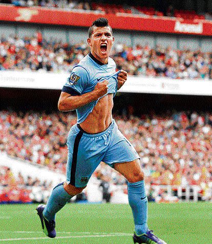 jubilant: Manchester City's Sergio Aguero is delighted after scoring against Arsenal at the Emirates Stadium on Saturday. The match finished 2-2. AP