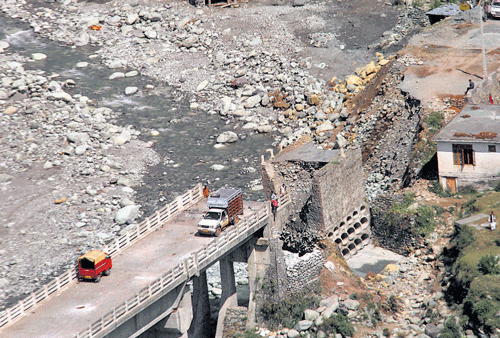 long road to ruin An aerial view of a bridge collapsed due to flash-floods in the Kotranka tehsil of Rajouri district in Jammu and Kashmir on Saturday. PTI