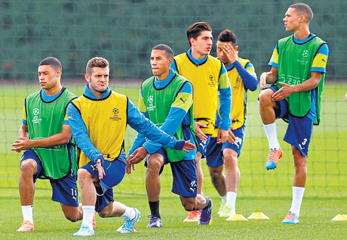 Arsenal players train on the eve of their Champions League clash against Borussia Dortmund. AP