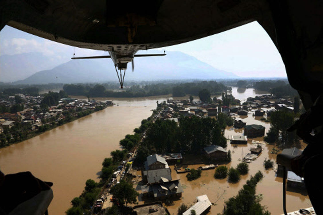 Rescue workers today spotted 13 bodies lying in a house in Jawahar Nagar area of the city, taking the death toll in flood-ravaged Jammu and Kashmir to over 200. PTI