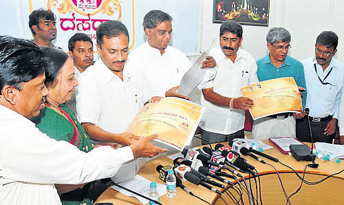 District in charge Minister V Sreenivas Prasad releasing the posters of Dasara Film Festival at DC's Office, in Mysore, on Tuesday. Information and Public Relation department Deputy director Prakash and others are seen. DH Photo