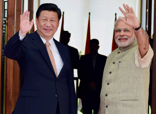 India and China today inked three pacts here, hours within the arrival of Chinese President Xi Jinping on a three-day visit to India during which the two countries will focus on boosting trade and investments, besides discussing substantive issues including the contentious border dispute. PTI photo
