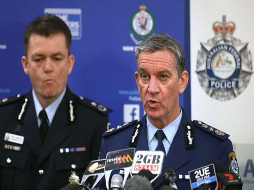 New South Wales Police Commissioner Andrew Scipione(r), and Australian Federal Police Acting Commissioner Andrew Colvin describe how 800 federal and state police officers raided more than two dozen properties as part of the operation in Sydney. Australian police detained 15 people earlier on Thursday in a major counterterrorism operation, saying intelligence indicated a random, violent attack was being planned on Australian soil. AP Photo