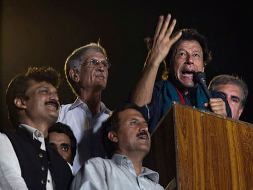 Earlier, Imran Khan announced that he would go to Karachi to thank party workers only after securing Prime Minister Nawaz Sharif's resignation. AP file photo