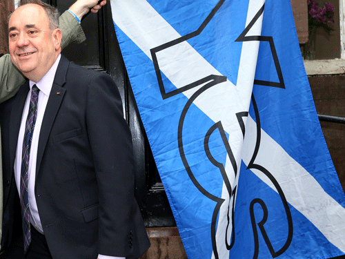 Scotlands First Minister Alex Salmond poses for photographs with Yes campaigners in Turriff, Scotland, Thursday, Sept. 18, 2014. Polls opened across Scotland in a referendum that will decide whether the country leaves its 307-year-old union with England and becomes an independent state. AP Photo