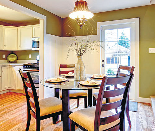 Hang full-length drapes from ceiling to floor, to create a vertical illusion and make your dining space look bigger.