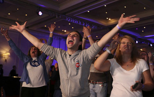 No supporters react to results in the Scottish independence referendum at the Marriott Hotel in Glasgow, Scotland as ballet papers are counted through the nigh Friday, Sept. 19, 2014. From the capital of Edinburgh to the far-flung Shetland Islands, Scots embraced a historic moment - and the rest of the United Kingdom held its breath - after voters turned out in unprecedented numbers for an independence referendum that could end Scotland's 307-year union with England. AP photo