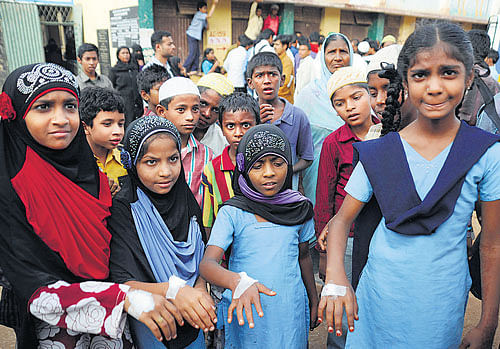 The midday meal was supposed to be nutritious, but these students had to be given medical aid after eating it. DH photo