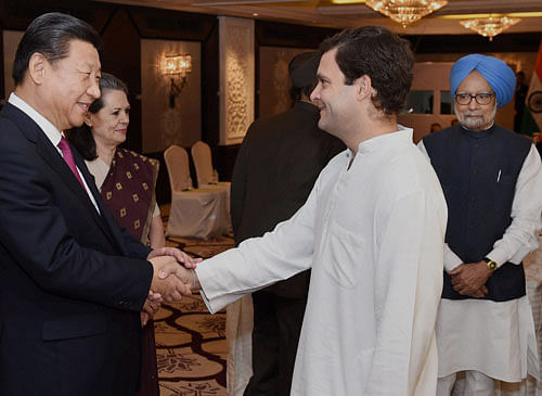 Congress Vice President Rahul Gandhi greets Chinese President Xi Jinping while Congress President Sonia Gandhi and former Prime Minister Manmohan Singh look on in New Delhi on Friday. PTI Photo