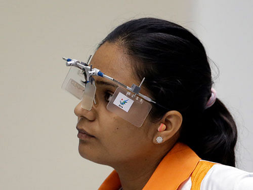 Original Indias bronze medal winner Shweta Chaudhry looks at the screen in the final of the 10m Air Pistol Women at the Ongnyeon International Shooting Range for the 17th Asian Games in Incheon, South Korea, Saturday, Sept. 20, 2014. AP Photo
