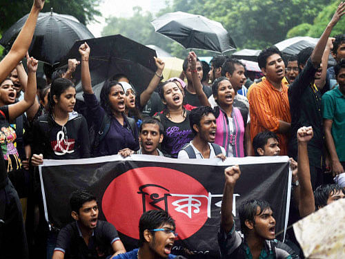 Students of Jadavpur University take part in a rally 'March to Governor House' in Kolkata on Saturday to protest against the police excesses over their agitation against molestation of the university girl. PTI Photo