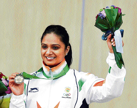 Bronze effect : Shweta Chaudhary shows off her medal after finishing third in the 10M air pistol on Saturday. pti
