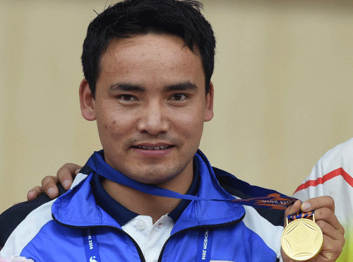 Gold medal winner India's Jitu Rai poses at the medal ceremony of Men's 50M Pistol shooting event at the 17th Asian Games in Incheon, South Korea on Saturday. PTI Photo