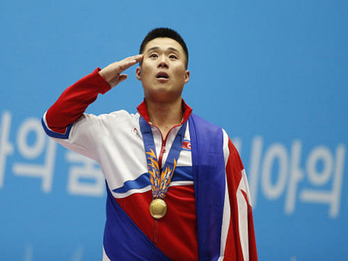 North Korea's Kim Un-Guk thanked his supreme leader Kim Jong-Un as he broke three world records on his way to gold in the 62kg class weightlifting at the Asian Games today. Reuters photo