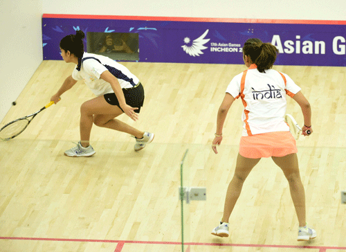 Indian squash players Dipika Pallikal and Joshna Chinappa during their (women singles) quarterfinal match at the 17th Asian Games in Incheon, South Korea on Sunday. PTI