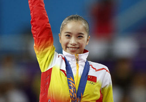Nineteen-year-old Yao Jinnan from China grabbed the gold medal while her team mate Shang Chunsong pocketed the silver medal in the women's all-around event at the Asian Games here Tuesday. Reuters Image