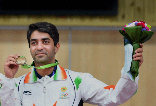 Abhinav Bindra, the golden man of Indian shooting, bid adieu to the Asian Games on a glorious note, winning his first individual medal of the continental bash and playing the lead role in securing a team bronze here on Tuesday. / PTI Photo