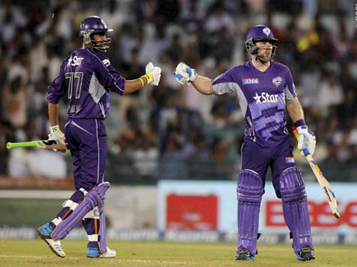 Aiden Blizzard and Shoaib Malik of Hobart Hurricanes punch gloves during the Champions League Twenty20 match against Northern knights at the Chhattisgarh International Cricket Stadium in Raipur. Hobart Hurricanes produced a commanding performance to beat Northern Knights by 86 runs in a Group B match to keep their hopes afloat in the Oppo Champions League Twenty20. PTI photo