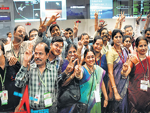 Staff from the Indian Space Research Organisation (Isro) celebrate after the Mars Orbiter Spacecraft (MoM) successfully entered the Mars orbit at the ISRO Telemetry, Tracking and Command Network (ISTRAC) in Bangalore on Wednesday. DH photo/Kishor Kumar bolar