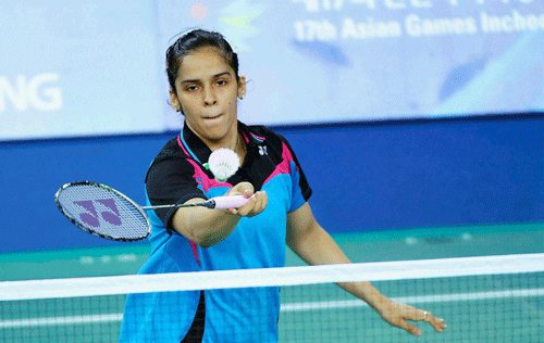 Saina Nehwal kept her maiden Asian Games individual medal hopes alive with another polished performance but P V Sindhu suffered a shock loss here in the badminton competition on Thursday./ PTI Photo