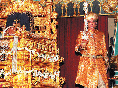 Chaduranga Kantharaj Urs carries the Royal Sword to be placed on the Golden Throne in Amba Vilas Palace, to mark the beginning of Navaratri celebrations, in Mysore on  Thursday. KPN