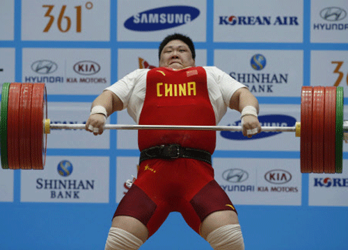 China's Zhou sets a new world record in the women's over 75kg clean and jerk weightlifting competition at the Moonlight Festival Garden during the 17th Asian Games in Incheon. Reuters photo