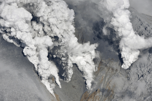 Dense fumes are spewed out from several spots on the slope of Mt. Ontake as the volcano erupts in central Japan Saturday, Sept. 27, 2014. Mt. Ontake erupted Saturday, sending a large plume of ash high into the sky and prompting a warning to climbers and others to avoid the area. Japanese broadcaster NHK, citing local authorities, said there were reports of injuries, but no word on their severity. It also reported that people had been evacuated from a mountain lodge. AP Photo
