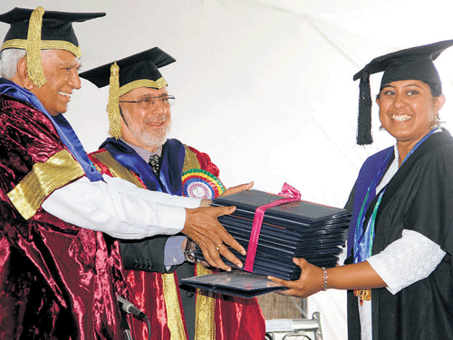 jubilations: Correia Salisha receives 15 gold medals from Governor Vajubhai Rudabhai Vala at the 7th Annual Convocation of the Karnataka Veterinary, Animal and Fisheries  Sciences University in Bidar on Saturday. dh Photo