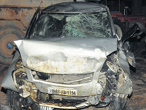 The mangled remains of the car in which the three peoplewere killed on Saturday. DH PHOTO