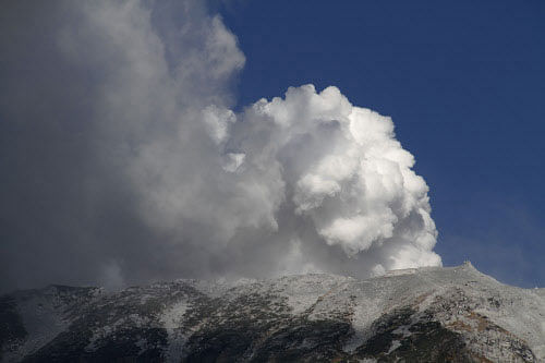 Military helicopters plucked seven people from a Japanese mountainside today after a spectacular volcanic eruption sent officials scrambling to reach many more injured and stranded on the mountain. AP photo