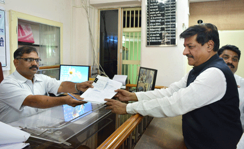 Maharashtra Chief Minister Prithviraj Chavan filing his nomination papers for Karad South constituency in Karad on Saturday. PTI Photo