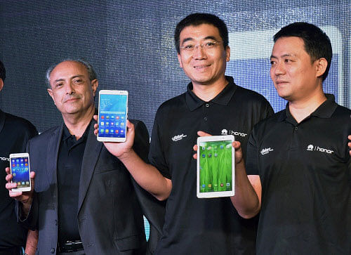 India CEO, Huawei Telecommunications (India), Cai Liqun (C) with VP-Retail Head- Brand Alliances, Flipkart, Michael Adnani (L) and President, Consumer Business Group India, Allen Wang at the launch of the Smartphones and Tablets during a press conference in New Delhi on Monday. PTI Photo