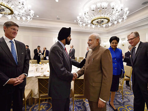 Prime Minister Narendra Modi shakes hands with Ajaypal Singh Banga of MasterCard after a breakfast meeting with American CEOs in New York, US on Monday. PTI Photo