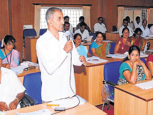 Member Satyananda Nayak speaks at TP meeting in Udupi on Monday. DH photo