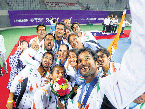 A jubilant Indian tennis contingent takes a selfie after signing off with the mixed doubles gold at the Asian Games on Monday. AP