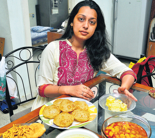 Lavish spread: Tejal with a Navaratri spread including puri, aloo-tomato curry, kadhee,  gathiya and barfi.