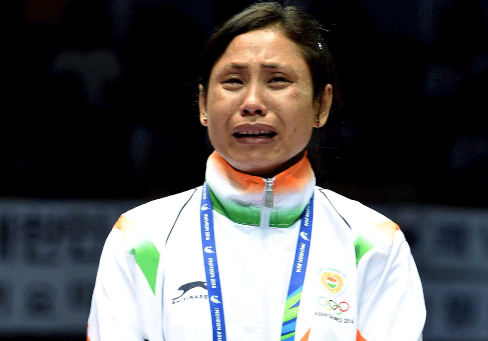 Indian boxer Sarita Devis emotional refusal to wear the bronze medal at the Asian Games podium inside the Seonhak Gymnasium today has not gone down well with some members of the national contingent. PTI file photo
