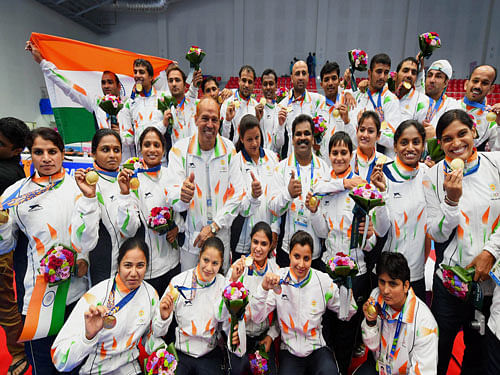Gold medal winning India's men's and women's Kabaddi teams pose for a group photo graph with their medals at the 17th Asian Games in Incheon. PTI photo