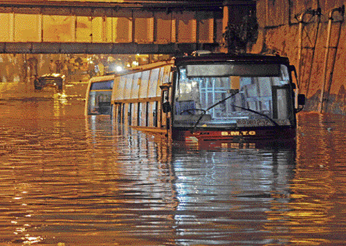 BMTC buses stranded at the underpass near Anand Rao Circle on September 26. DH photos/Srikanta Sharma, S K Dinesh