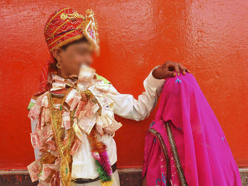 Increasing the legal age of marriage for girls from minimum 18 years was mooted by the Madras High Court on Wednesday as a way out to check instances of hundreds of women getting married at an young age only to be separated a few years later / AP file photo