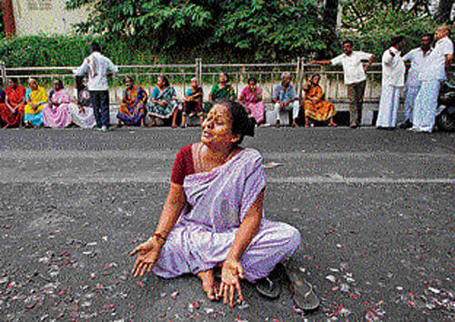 A supporter of former Tamil Nadu chief minister Jayalalitha wails on a road in Chennai on Tuesday. AP