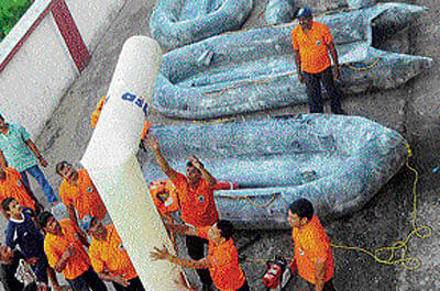 In event of disaster: Personnel of the Odisha Disaster Rapid Action Force check their  equipment in preparation for Cyclone Hudhud in Bhubaneswar on Wednesday.   PTI