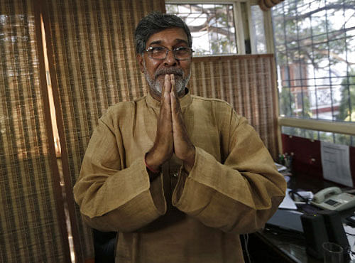 Indian children's right activist Satyarthi gestures as he speaks with the media at his office in New Delhi. Reuters photo