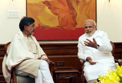 Prime Minister Narendra Modi meets Nobel Peace Prize awardee from India, Kailash Satyarthi in New Delhi on Saturday. PTI Photo