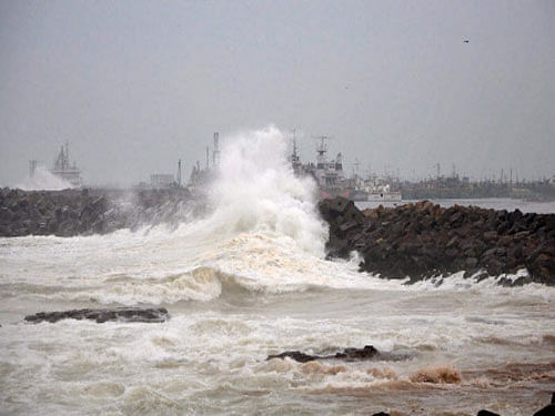 High tides lash the Ramakrishna beach in Visakhapatnam as an effect of Cyclone Hudhud on Saturday. Strong winds and heavy rains led to large-scale disruption of power lines in three coastal districts of Andhra Pradesh as the state braced for Hudhud, a very severe cyclonic storm that is expected to hit the coast around noon today. PTI Photo