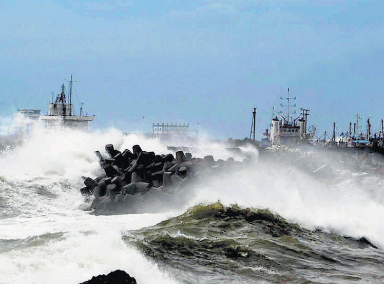 Tidal waves hit the beach as Cyclone Hudhud pounds the port city of Visakhapatnam on Saturday. PTI