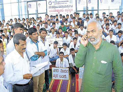 MLA A Manju seen interacting with the students of Hassan Veterinary College, on Monday. DH Photo